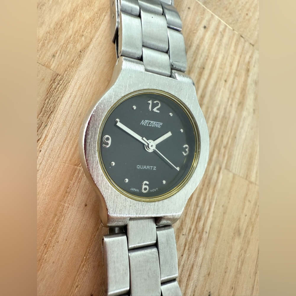 Nelsonic ladies black dial silver tone watch NEW BATTERY